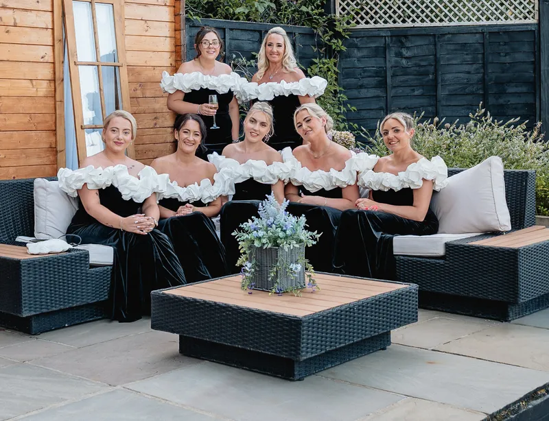 Bride and bridesmaids on the terrace at The Orchard