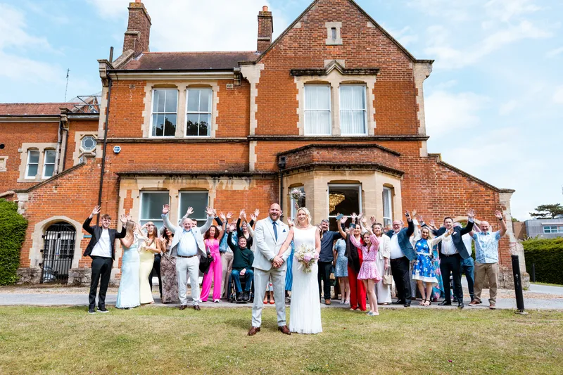 Wedding guests on the lawn in front of Oakwood House, Maidstone