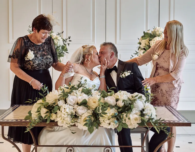 Signing the register at a Friern Manor wedding