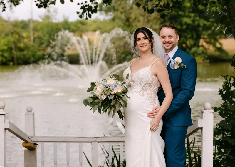Couple by the lake and fountain at Chilston Park Hotel
