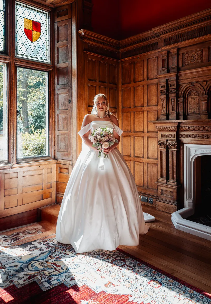 Bride in a wood-panelled room at Oakwood House