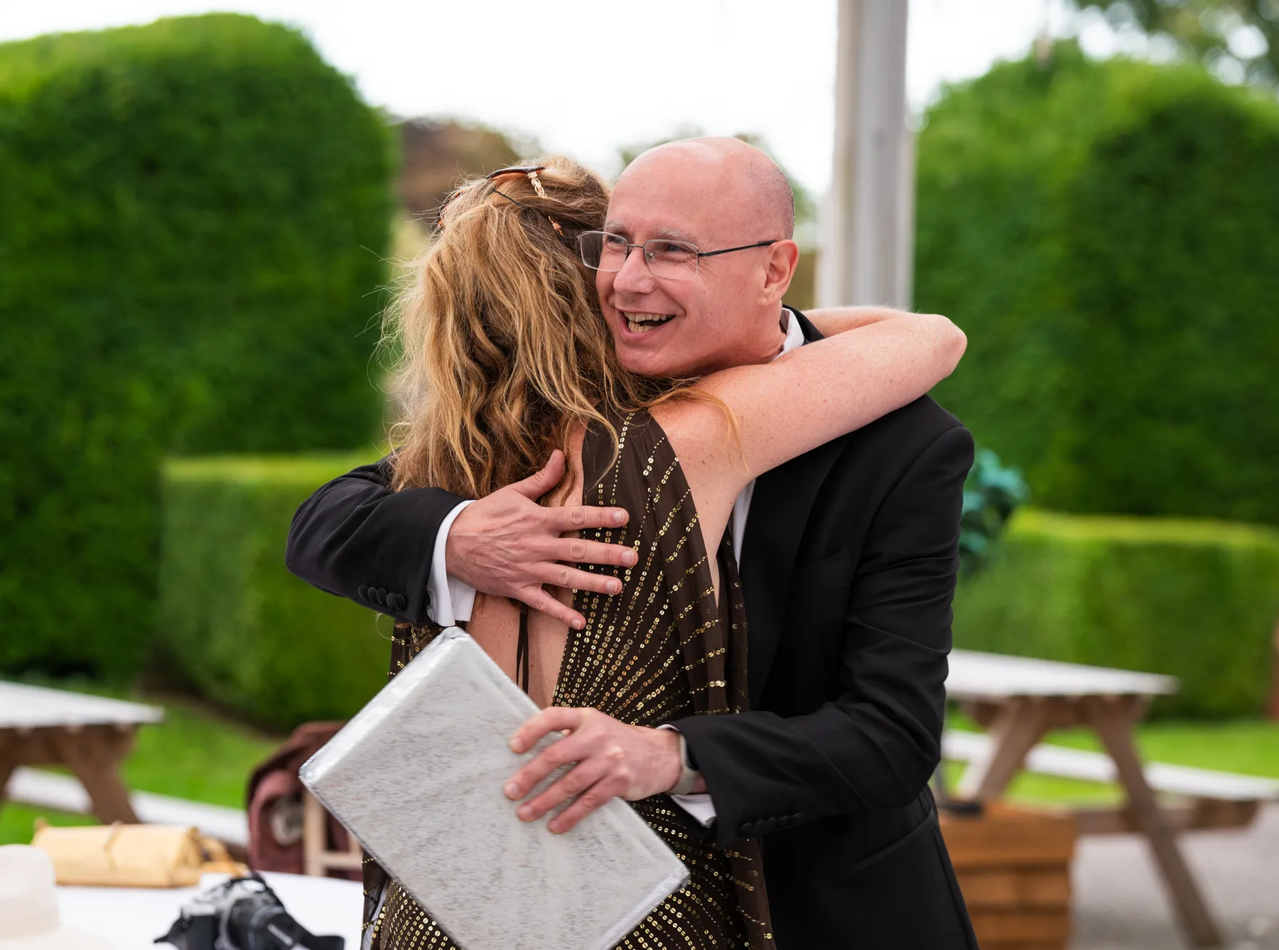 Guests hugging at a party in Kent