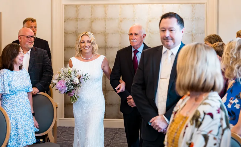 Couple walking out after the ceremony at Oakwood House