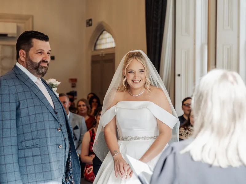 Bride and groom during the ceremony at Oakwood House