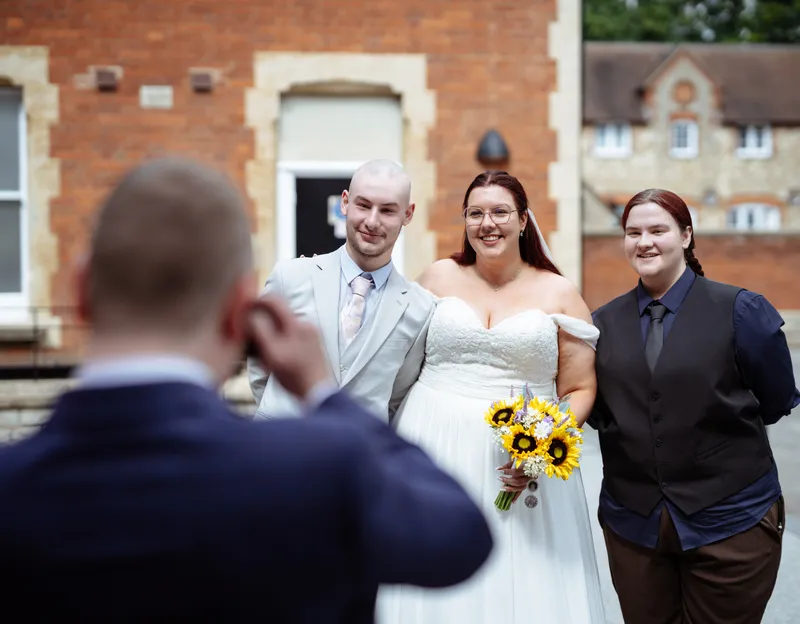 Guest photographing the couple at Oakwood House