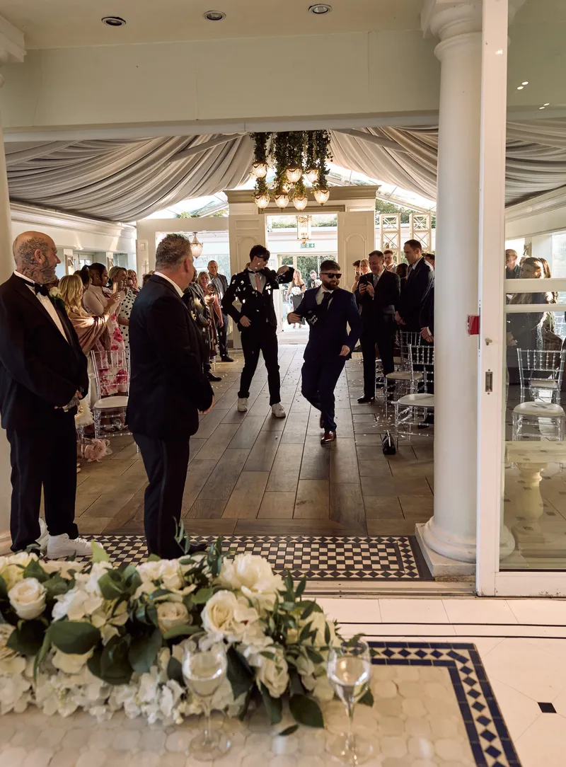 Bride walking down the aisle at Friern Manor