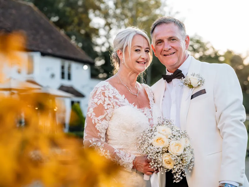 Couple portrait in golden evening light at The Orchard