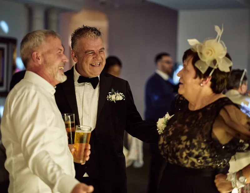 Guests laughing at the evening reception at Friern Manor