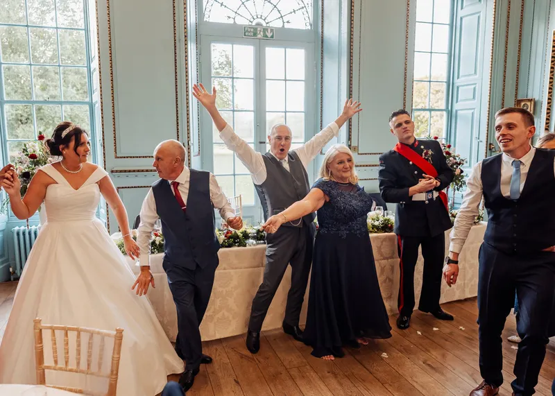 Family dancing in front of the top table at Bradbourne House