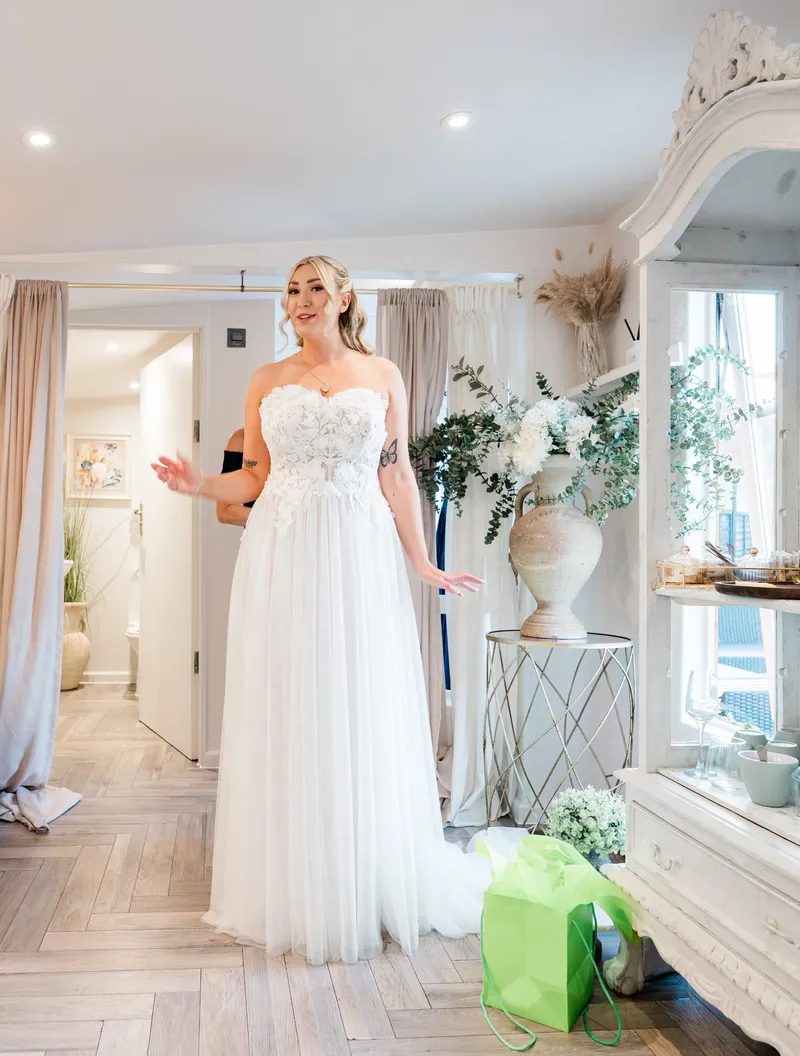 Bride in her dress in the bridal preparation room at The Orchard, Bearsted