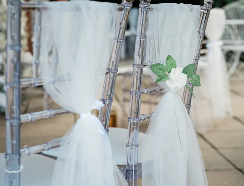 Tulle and rose chair decoration for the ceremony at The Orchard