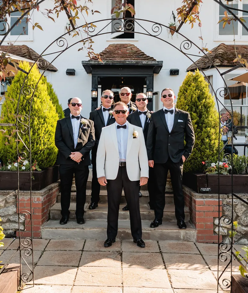 Groom and groomsmen in sunglasses outside The Orchard, Bearsted